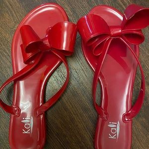 New- Red plastic flip flop size 7